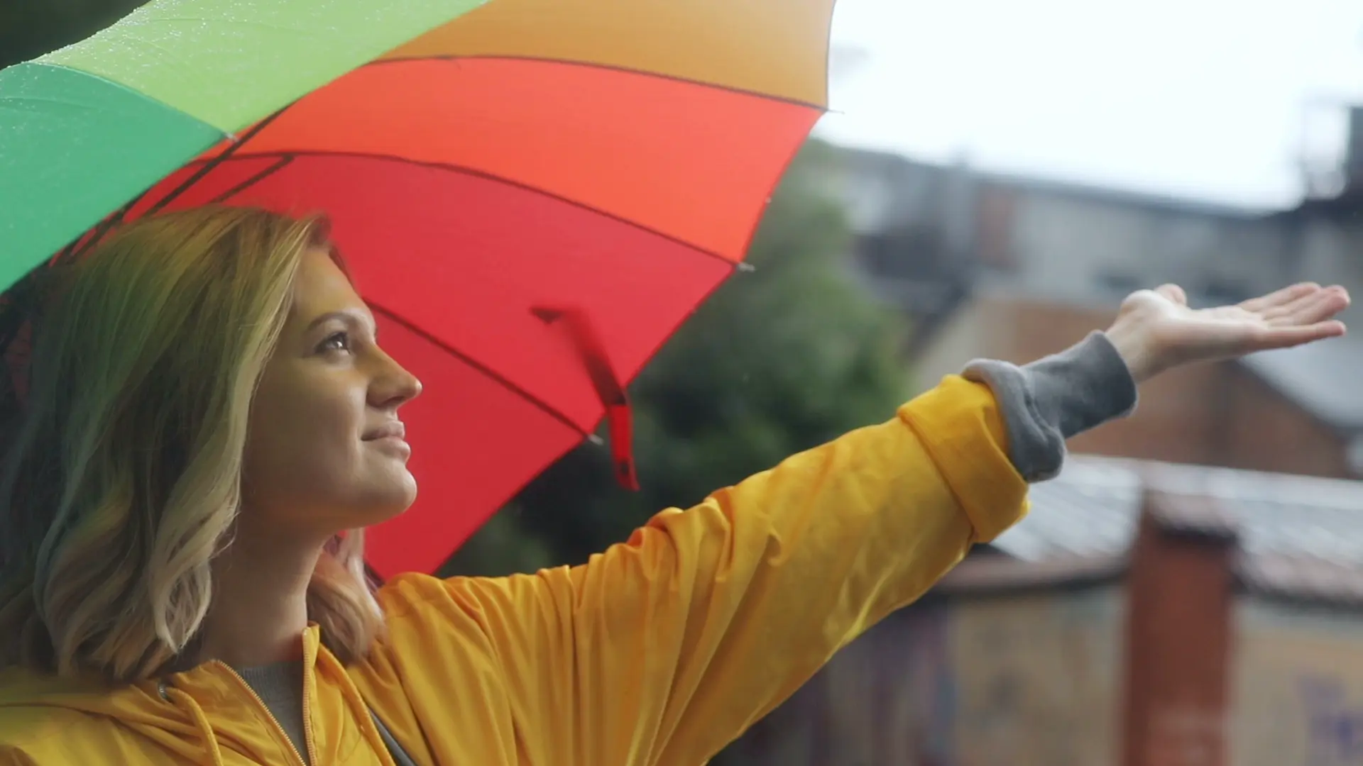 Woman in rain with umbrella